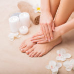 Woman at spa with done manicure and pedicure