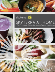 The cover of a book, called, Skyterra at Home The Cookbook: Simple Recipes to Elevate Your Meals with images of various bowls of food in the background and surrounding the title.